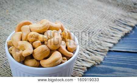 cashew nuts salted and roasted isolated on white background (center of selective focus)