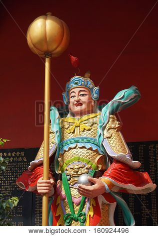 God Statue At The Main Gate Of Chinese Temple