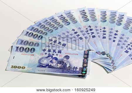 New Taiwan Dollars Fanned Out On White Background