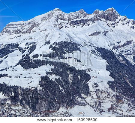 View from Mt. Titlis in Switzerland in winter. Titlis is a mountain, located on the border between the Swiss Cantons of Obwalden and Bern.