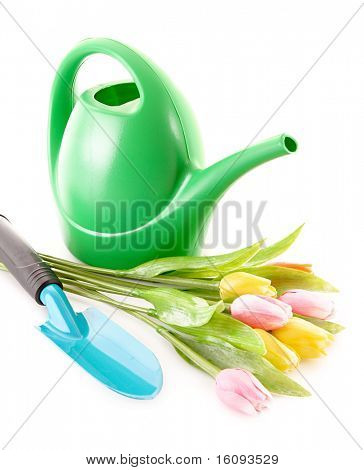 Bailer med blomst og skovl isoleret på hvid