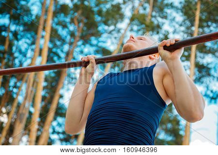 Pleasant Hard Working Man Doing Chin Ups