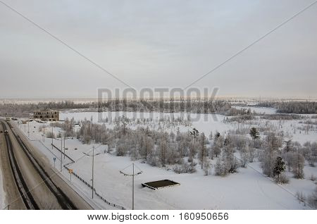 Road in the winter street. Evening, sunset