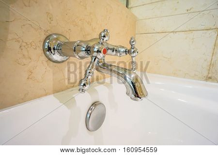 close up bathtub faucet in the bathroom
