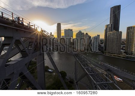 BRISBANE, AUSTRALIA - December 5 2016: Brisbane Story Bridge summit viewing platform and stairway silhouette as the sun sets over Brisbane City.