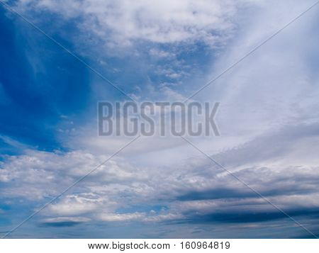 Dramatic skyscape on the Welsh coast in early summer featuring primarily cirrus and cirrostratus clouds.