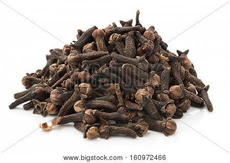 Heap of dried cloves, syzygium aromaticum, isolated on white background.    