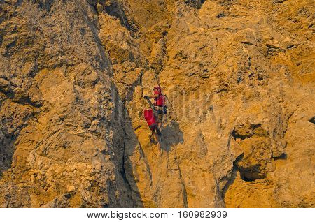 Rock climber on a steep rock. Cape Alchak Crimea.