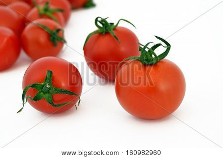 On white & copy space fresh healthy cherry tomatoes stock pictures