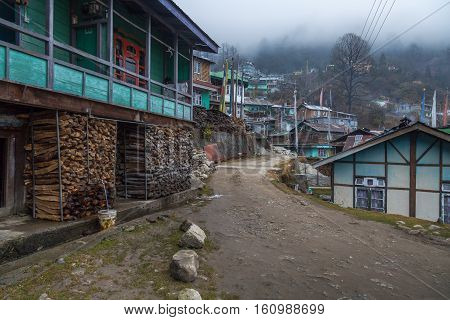 Indian small hillside village town of Lachen, Sikkim on a foggy winter morning.