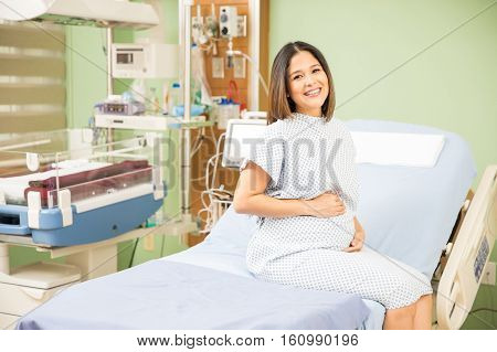 Pregnant Woman In A Hospital Bed