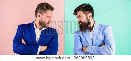 Business Competition And Confrontation. Business Partners Competitors In Suits With Tense Bearded Fa