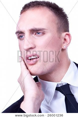 Young business man with a teethache against a white background