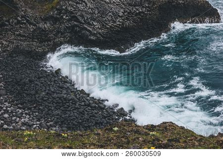 Aerial View Of Waves Crashing On Rocky Coast In Arnarstapi, Iceland