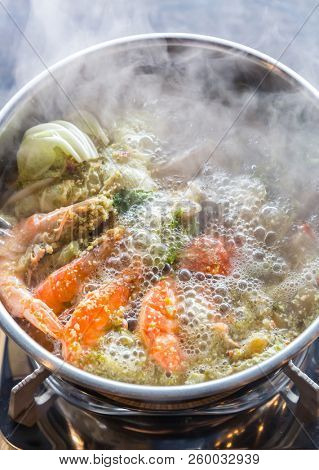 Seafood spicy hot pot crab prawn fish squid tumyum