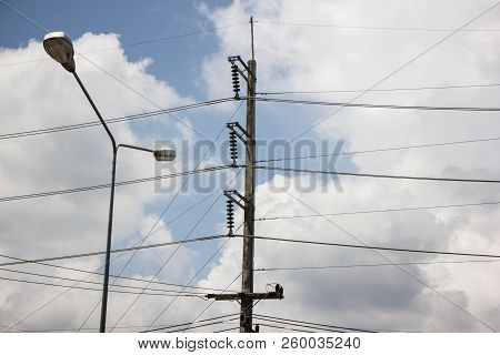 Closeup Eletricity Line And Electricity Post