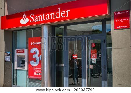 Barcelona, Spain - June 20, 2017: Facade Of An Agency Of The Spanish Banking Group Santander On A Su