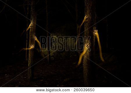 Long Exposure Photograph With Lightpainting Technique Representing An Illuminated Man.
