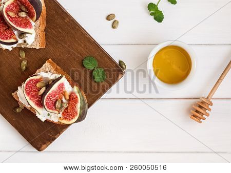 Delecious Ricotta Toast With Figs And Coffee On The White Table