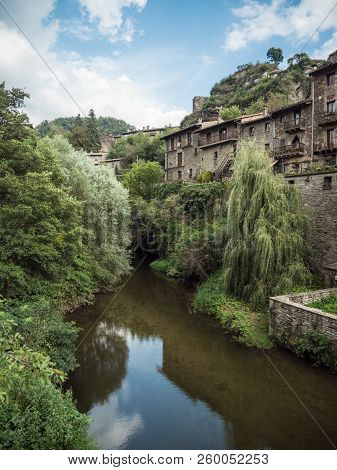 Vertical View Of The Rupit River Running Through The Village Of Rupit I Pruit In Summertime