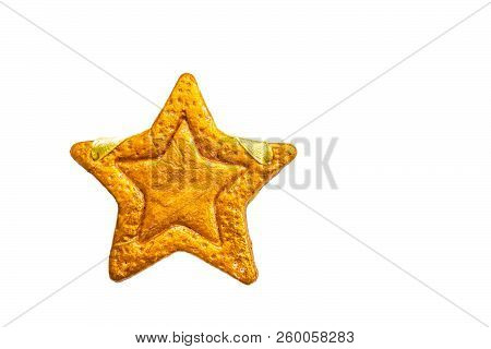 Decorative Golden Star Handmade From Dough Isolated On A White Background. View Of The Top.