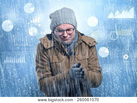 Young businessman shivering with graphs, reports and chart concept