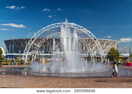 Recreation Park With A Dry Fountain And Benches In Front Of The New Football Stadium