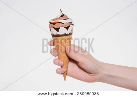 Close Up Photo Of Woman's Hand Holding Showing Presenting Tasty Yummy Beautiful Ice-cream With Choco