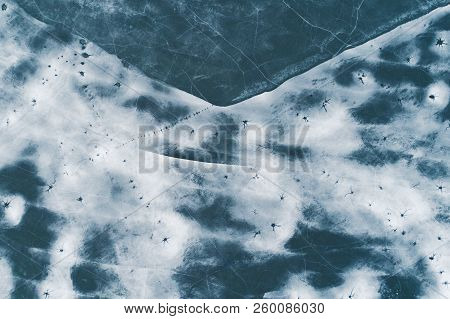 Ice Texture, Crackes, Ice Holes And Snow Drifts