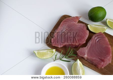 Raw Tuna Steak Wooden Cutboard Lime Slice Olive Oil Rosemary Isolated White Background Copy Space To