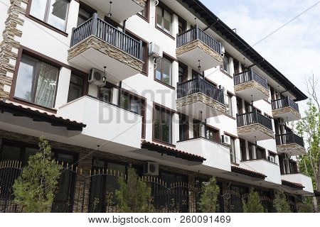 Modern Building Exterior. Facade Of A Modern Apartment Building. Vacation Complex Hotel Building, Wi