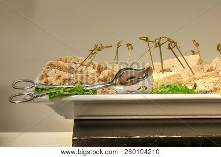 Tuna Sandwich Made With Tunafish, Mayo And Pickles On Wheat Bread At A Buffet.