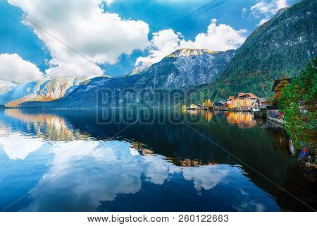Scenic View Of Famous Hallstatt Mountain Village With Hallstatter Lake. Sunnny Autumn Evening On Hal