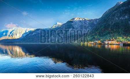 Scenic View Of Famous Hallstatt Mountain Village With Hallstatter Lake. Sunnny Autumn Evening On Hal