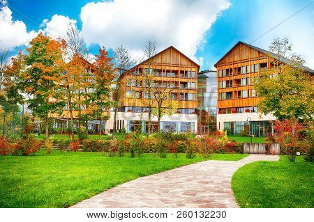 Picturesque Autumn Scene Of Altausseer Village. Sunny Morning View Of Hotels In Altaussee Village. L