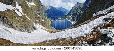 Morskie Oko. High Tatras, Poland, May 27, 2018. Beautiful landscape of snowy mountain tops and the lake between them. View from the mountain Rysy.