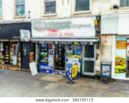 Blurred View Of Newsstand On On One Of Old London Street. English Landmark- Newsstand With The Right