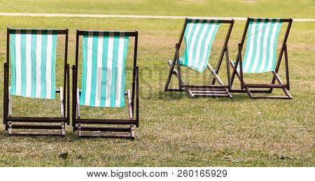 Four Deckchairs For Hire In Hyde Park. Westminster. London. England.