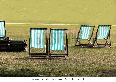 Four Deckchairs For Hire In Hyde Park. Westminster. London. England.