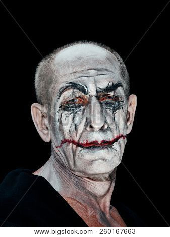 Bloody Halloween Theme: The Crazy Maniak Face On Dark Studio Background