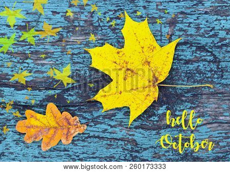 Hello October.colorful Autumn Background With Autumn Leaves On Blue Colored Old Wooden Texture.yello
