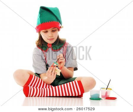 ein Christmas Elf Gemälde ein wenig hölzerne trainieren Modul für Santa am Weihnachtsabend geben. isoliert 