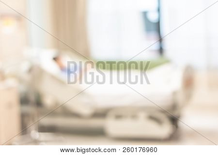 Patient On Hospital Bed, Medical Blur Interior Background White Room Ward With Nursing Care Or Healt