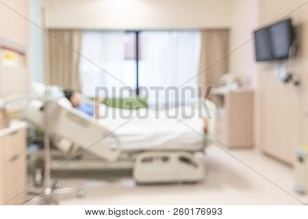 Patient On Hospital Bed, Medical Blur Interior Background White Room Ward With Nursing Care Or Healt