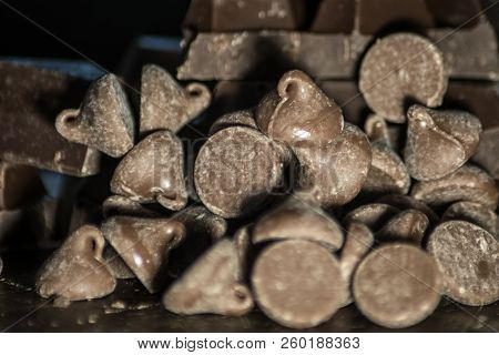 Thick Tasty Milk Chocolate Kises On Black Background