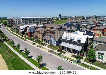 Colorful Homes In New Urban Development Aerial Drone View Of Solar Panels Covered All The Rooftops I