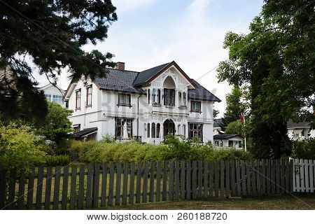 Hamar, Hedmark, Norway - 26 July 2018: Wooden Fence And Beautiful Living House