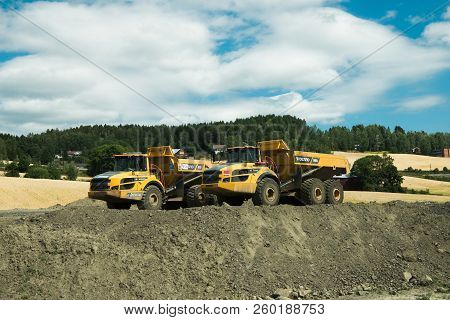 Hamar, Hedmark, Norway - 26 July 2018: Two Dump Trucks Working At Construction