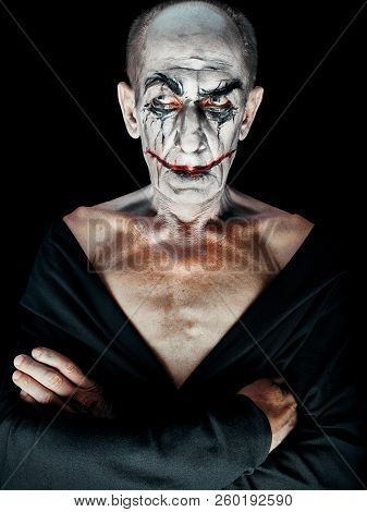 Bloody Halloween Theme: The Crazy Maniak Face On Dark Studio Background
