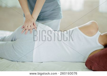 Asian Girl Having Massage By Her Friend At Home